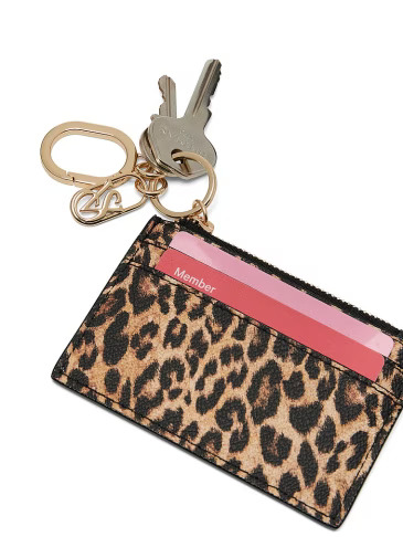 Victoria's Secret leopard print card holder with cards inside and keychain attached to it