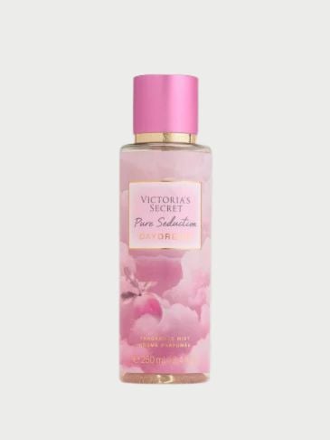 Victoria's Secret pink bottle of perfumed mist on a light grey background