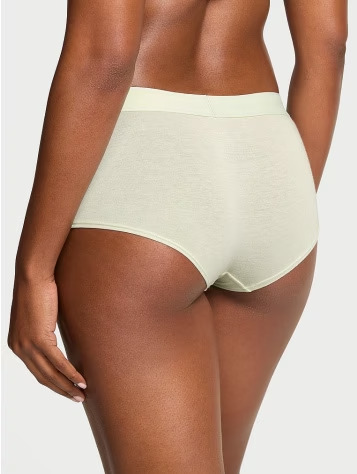 Back view of a woman wearing Victoria's Secret ivory boyshorts panties